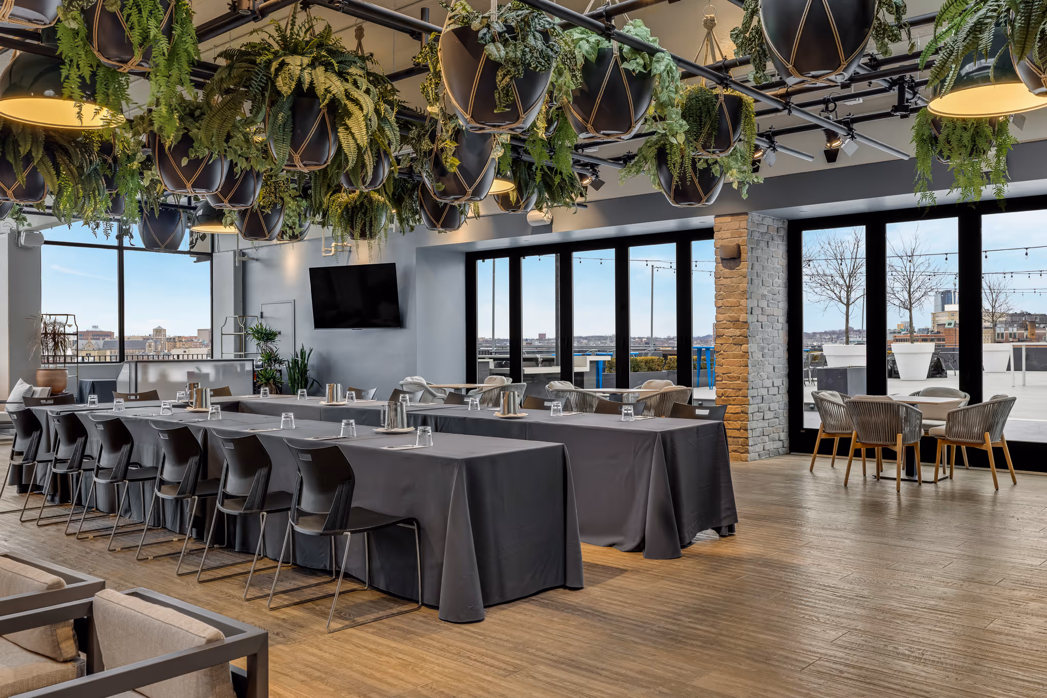 Hotel restaurant or lounge area with seating and city views