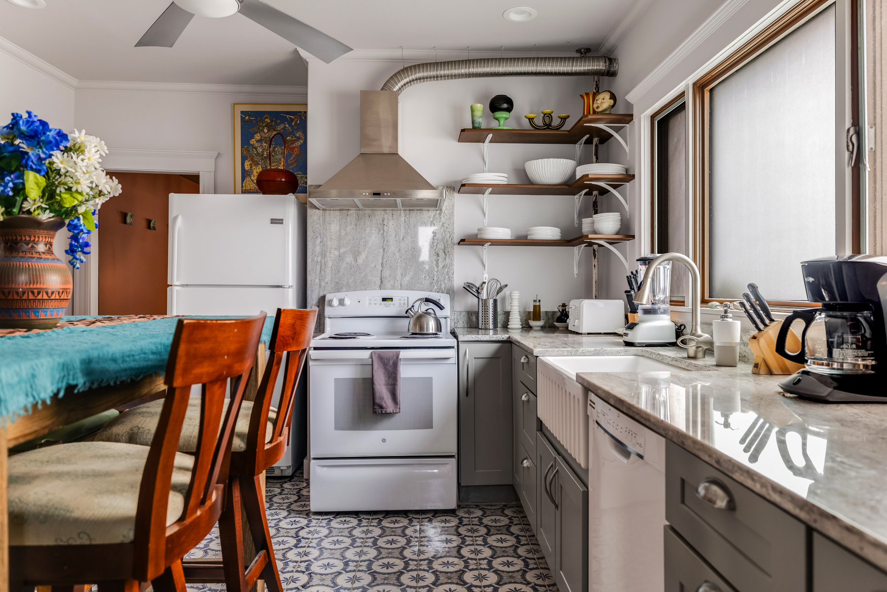 Kitchen with breakfast bar and seating in Medford Airbnb