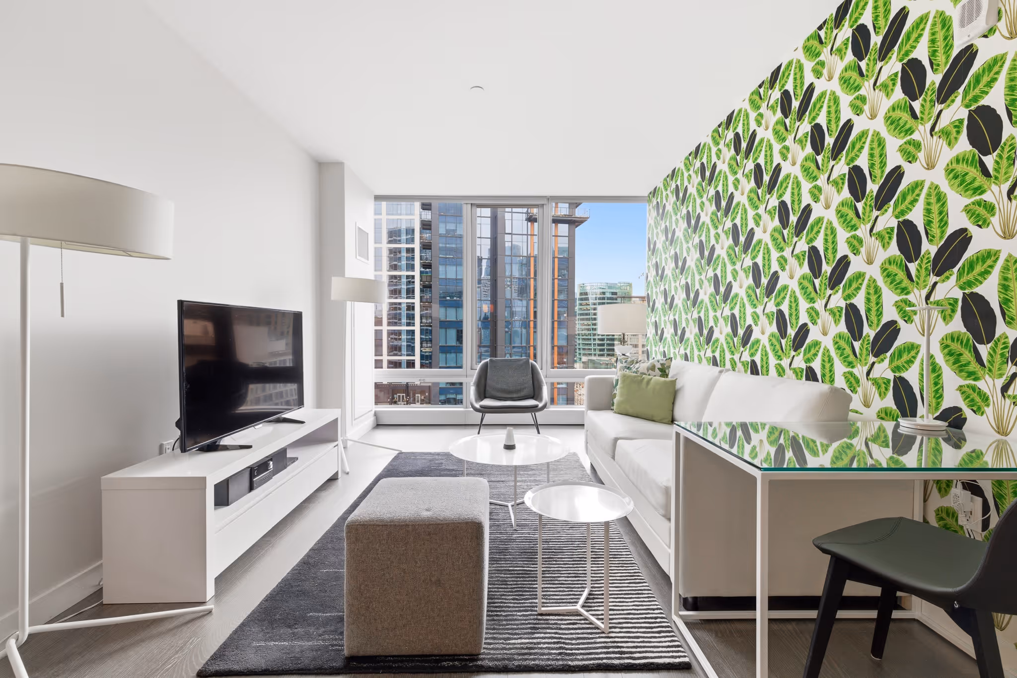 Boston real estate photography living room with green feature wall and city view