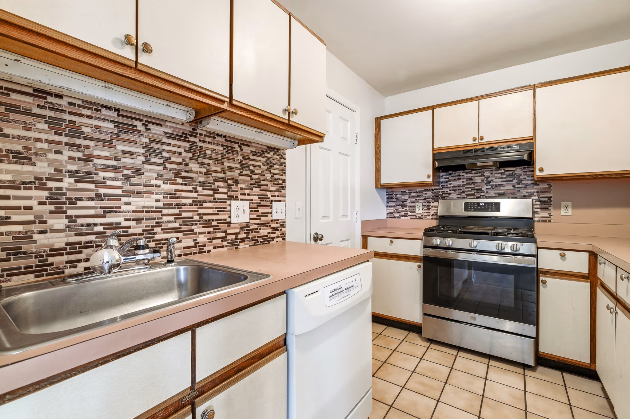 Kitchen with cabinets and appliances in Boston real estate listing