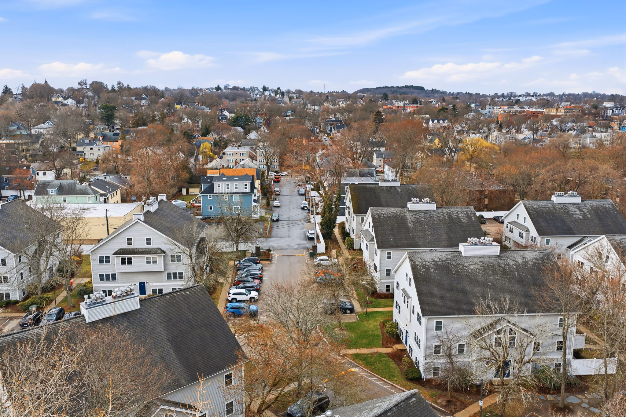 Aerial drone view of Boston residential neighborhood with multi unit homesDrone view of Boston neighborhood showing surrounding homes
