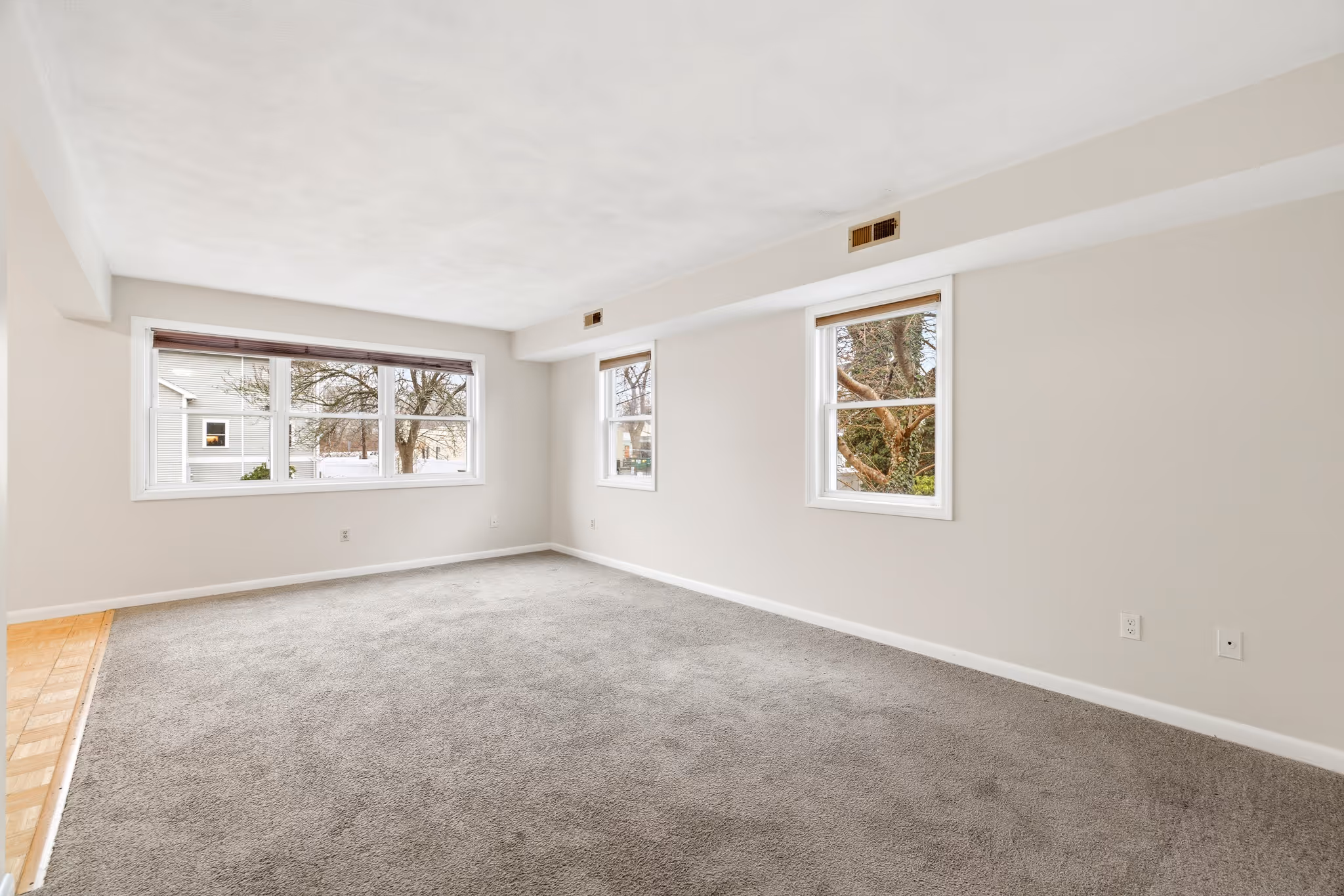 Wide living room view with open layout in Boston condo