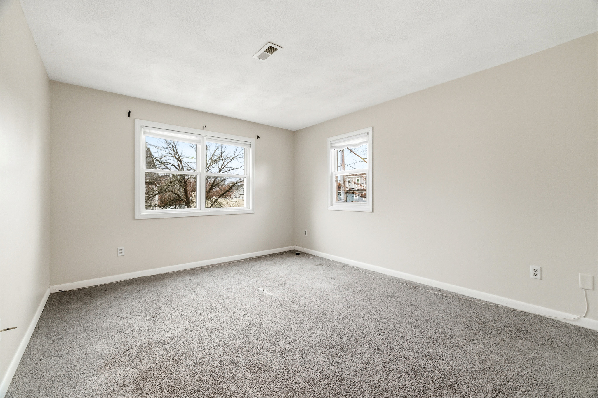 Bedroom with carpet and natural light in Boston condo