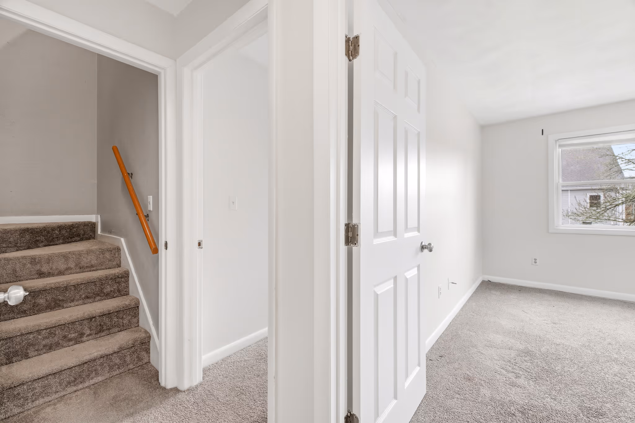 Stairs connecting levels in Boston multi floor condo