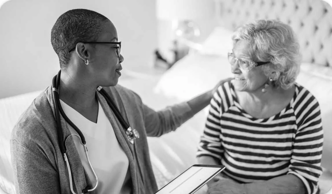 Black and white doctor visit, cybersecurity for healthcare