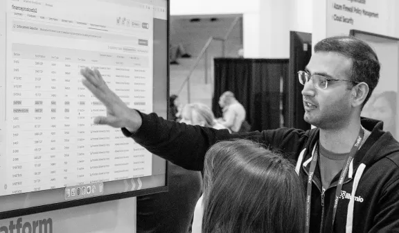 A person examining a spreadsheet of data.