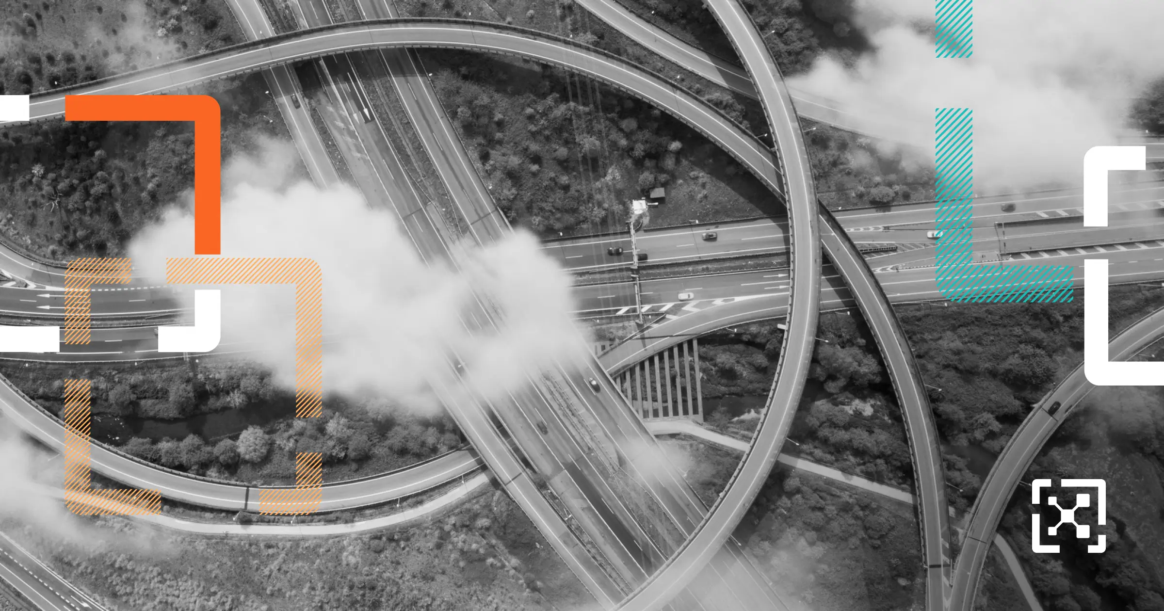 Black and white clouds above an interstate interchange