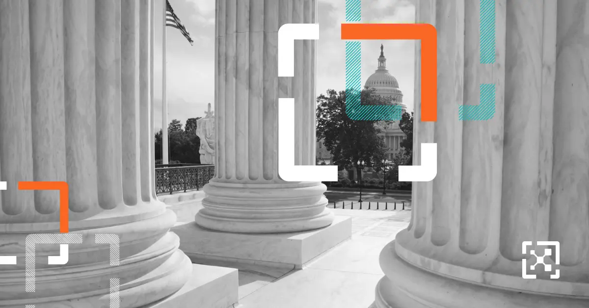 Black and white columns, American flag, and Capital Building
