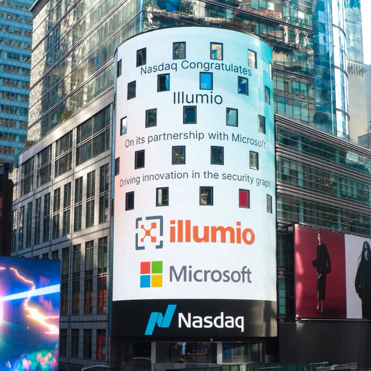 A digital Nasdaq billboard in Times Square congratulating Illumio on its partnership with Microsoft