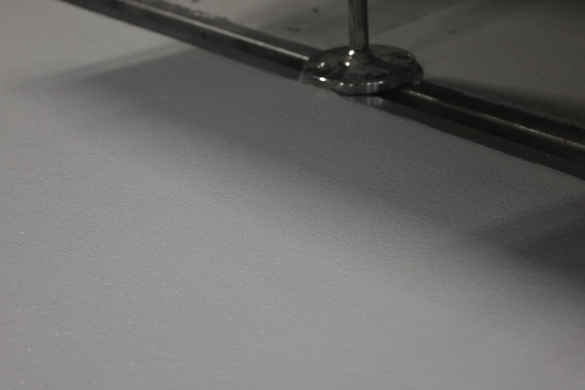 Industrial safety flooring systems: High-traction anti-slip coatings and OHSA-compliant safety line striping for SW Ontario facilities.