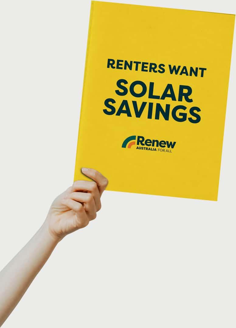 Hand holding a placard reading Renters want solar savings with a Renew Australia for All logo at the bottom