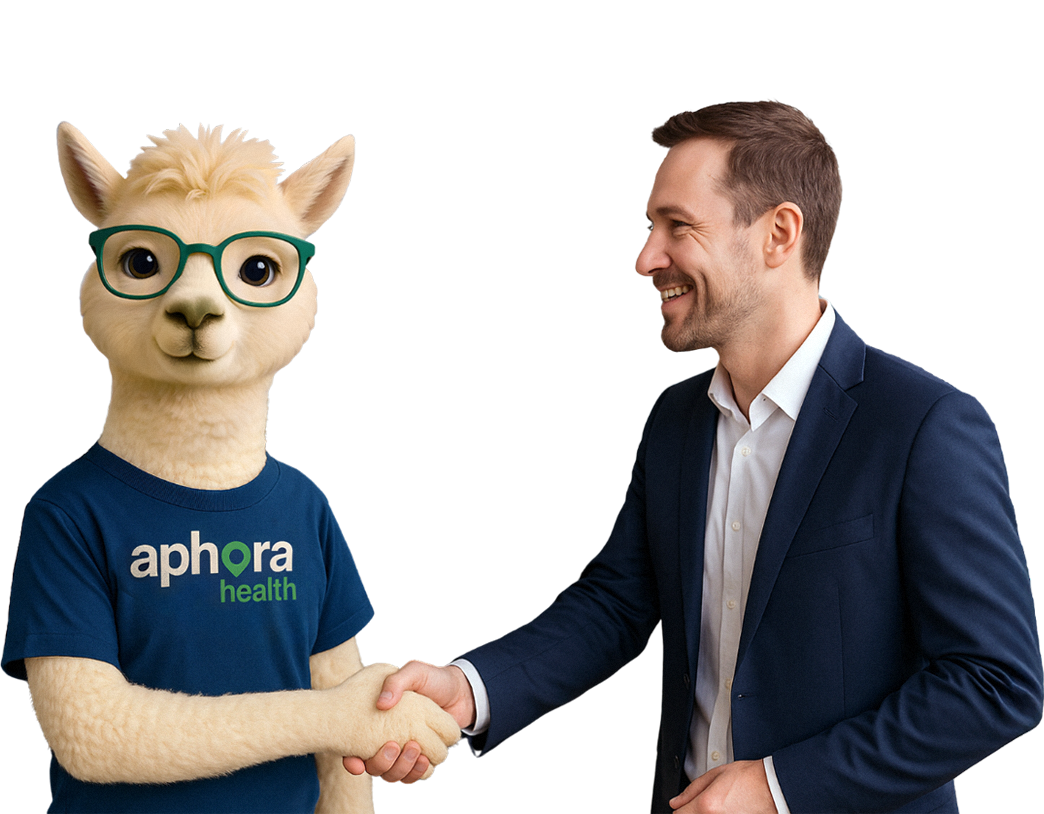 A man in a suit shaking hands with a friendly alpaca mascot named Nora wearing glasses and an Aphora Health t-shirt.