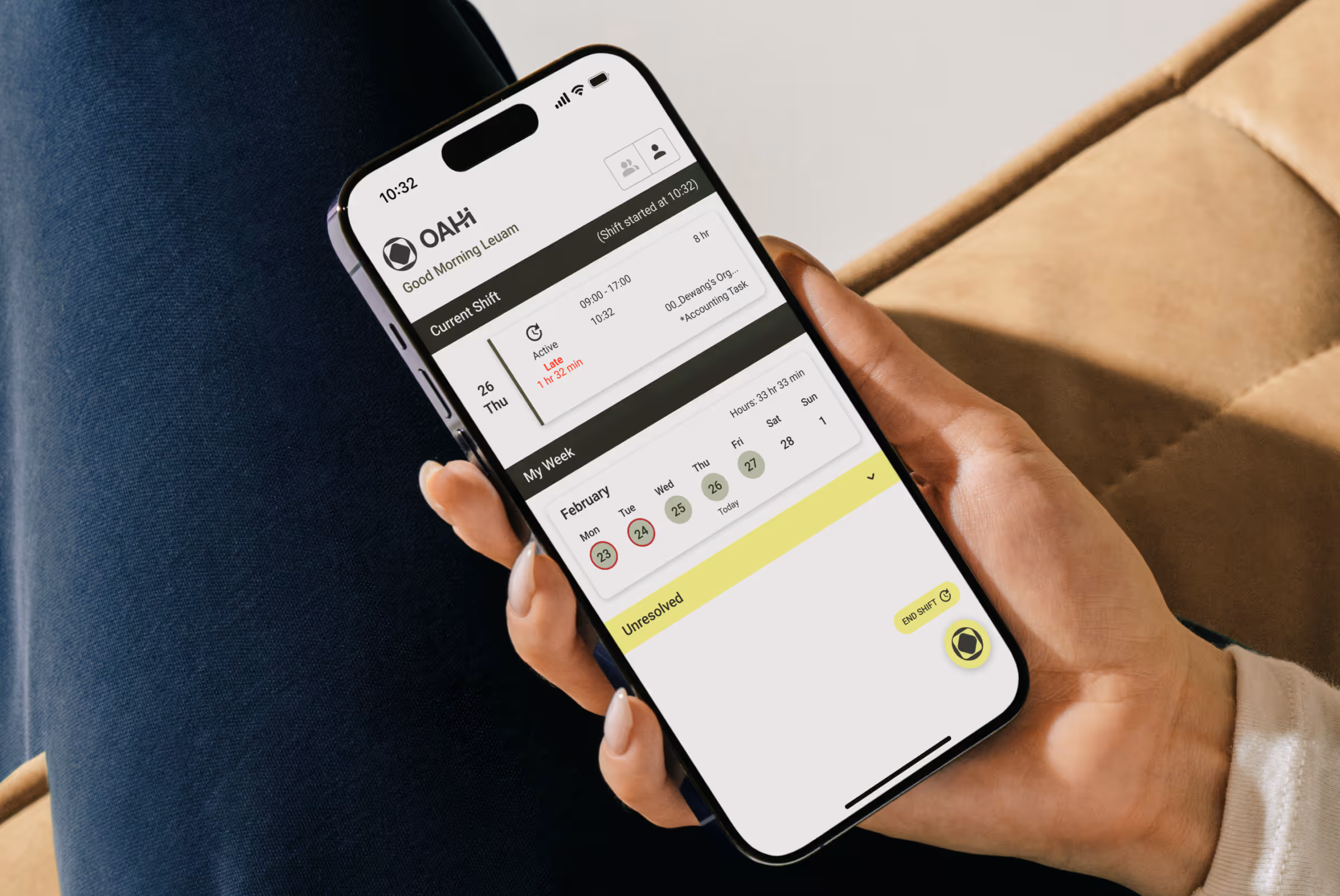 Woman sitting down with an iPhone in hand, running the OAHI mobile app