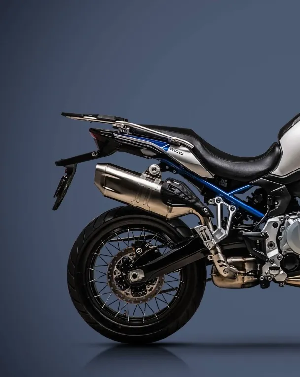 Side profile of the VOGE DS900X adventure motorcycle in studio lighting