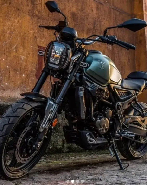 VOGE 300ACX motorcycle in a rustic outdoor setting, emphasizing durability and adventure-ready design.