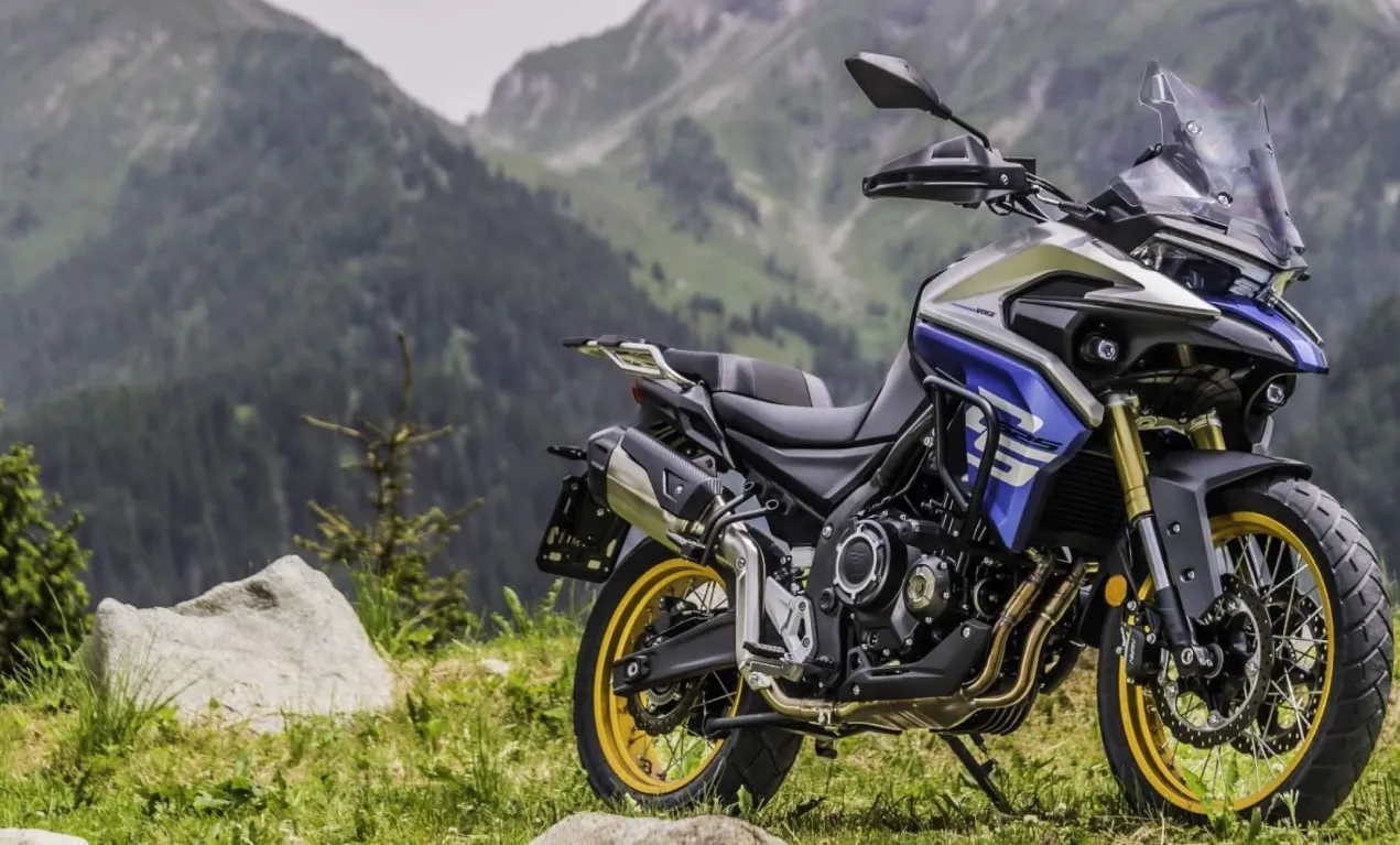 Voge 525 DSX adventure motorcycle riding through scenic mountain terrain.