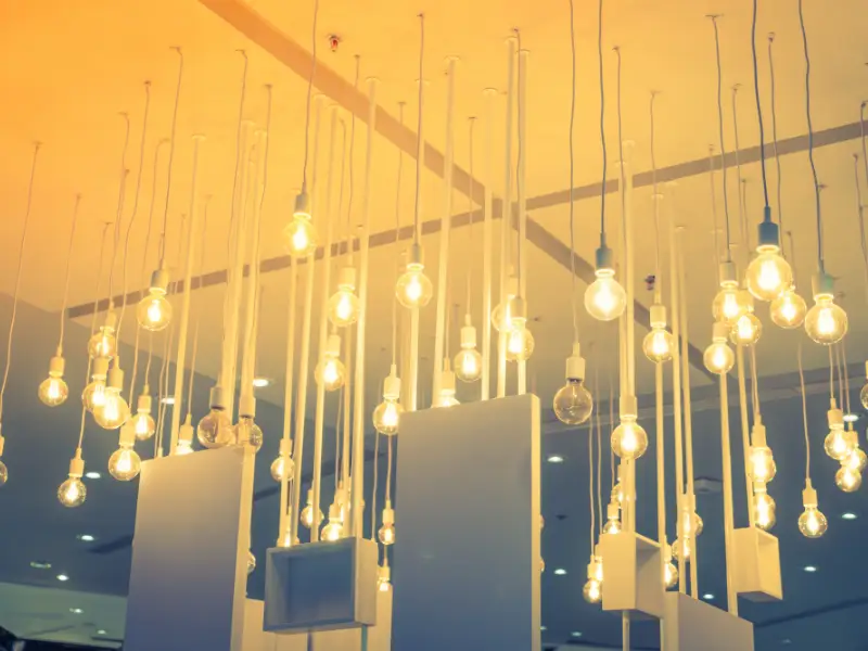 Hanging vintage light bulbs creating warm illumination in modern interior