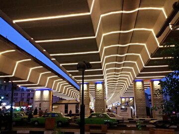 Modern architectural interior with geometric lighting and illuminated pillars