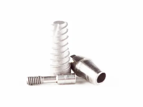 A couple of screws sitting on top of each other.