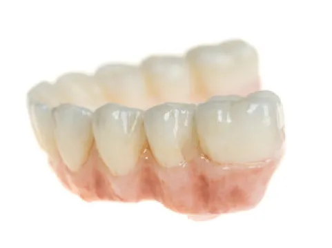 A close up of a tooth on a white background.