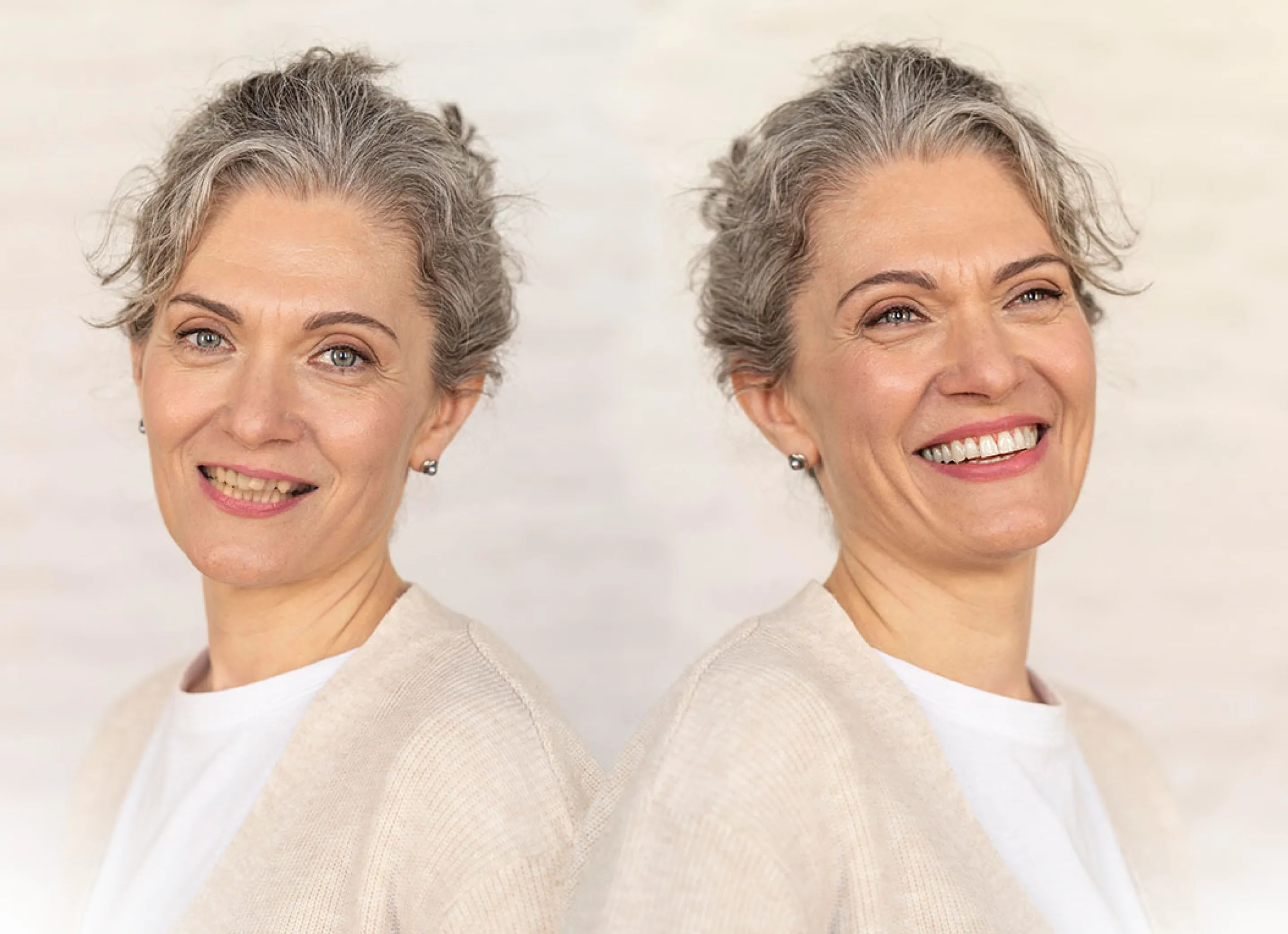 A woman with gray hair and a white shirt.