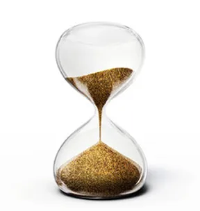 An hourglass with gold sand running through it.