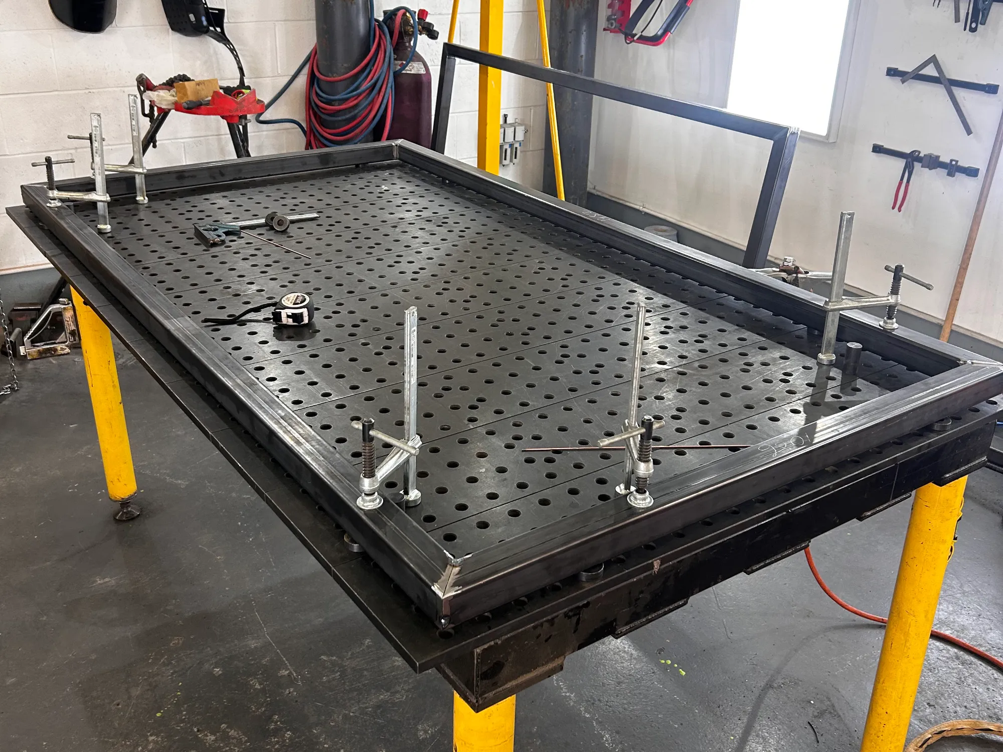 Converting a shipping container into a functioning drinks bar at the St.Johnstone Football Club fanzone by installing two hinged serving hatches.
