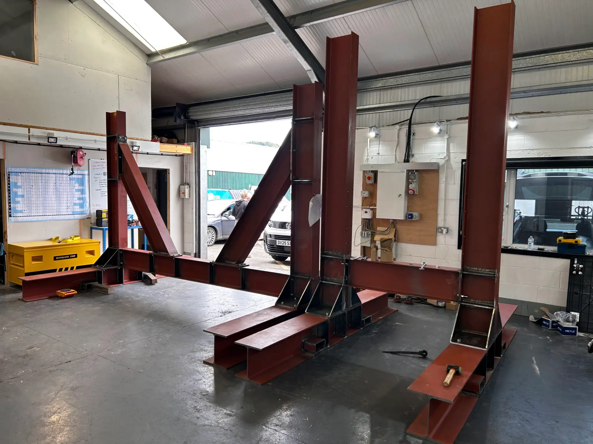 Fabricating custom stands to support turbine blades during maintenance and blade changes.