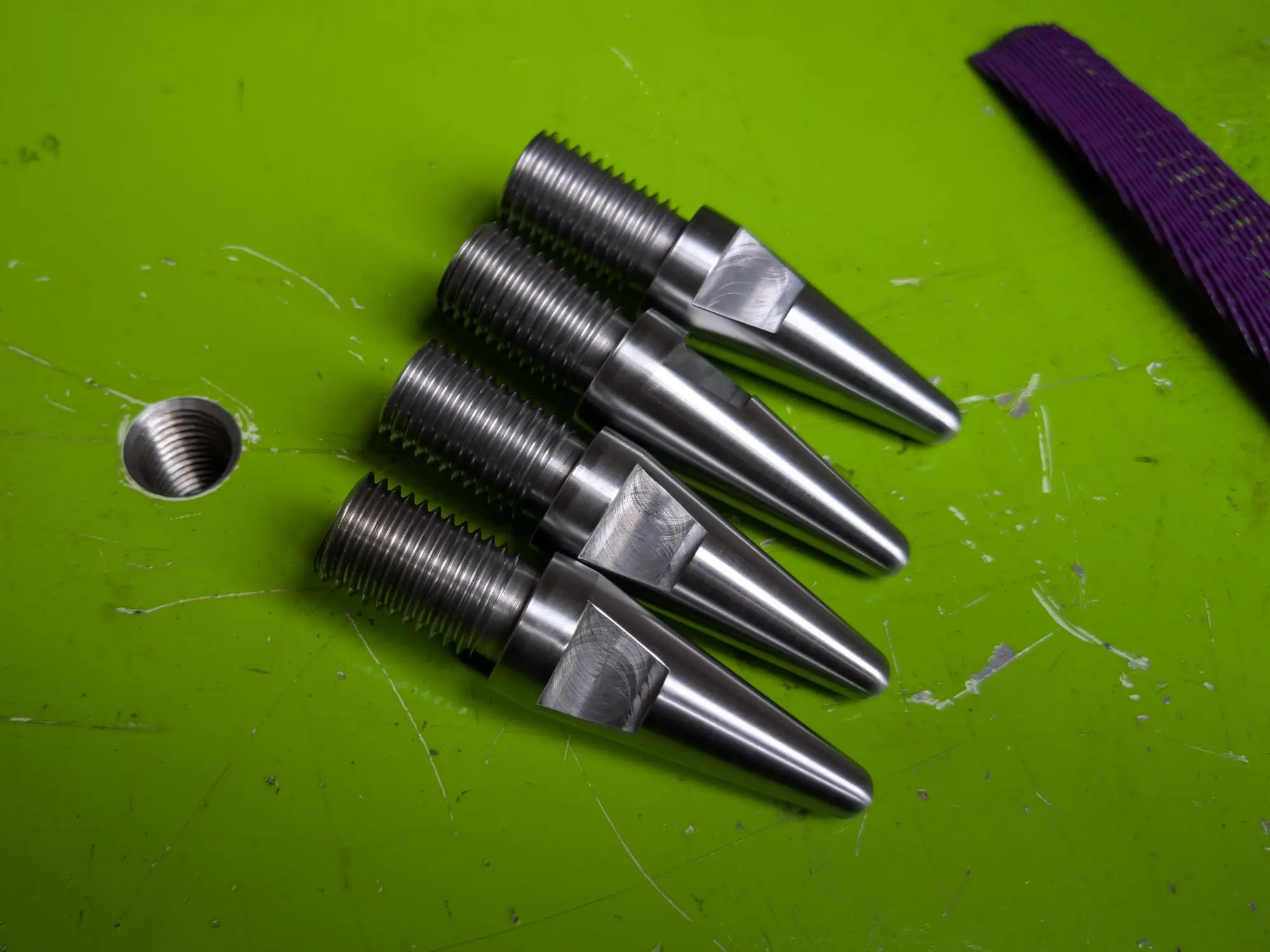 Tappered pins machined for guiding mating flanges together