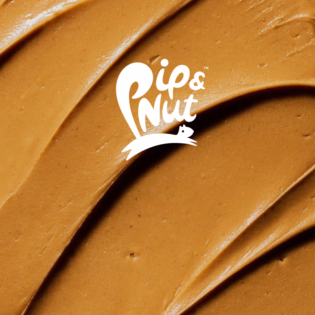 Smooth peanut butter spread with white Pip & Nut logo featuring a squirrel.
