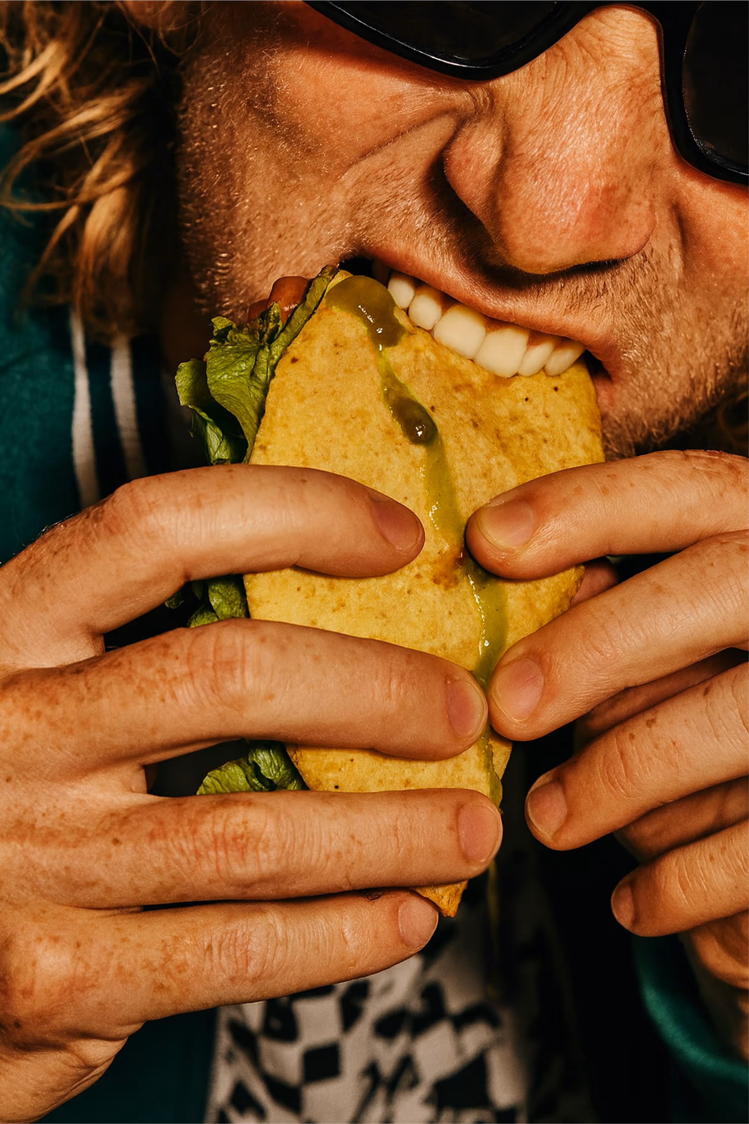 Man eating taco