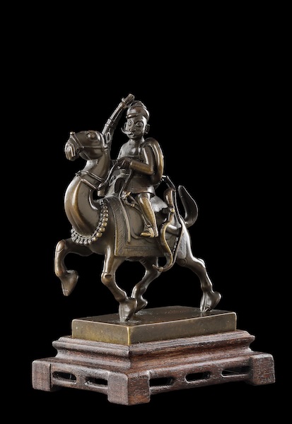 Toy of a moustachioed warrior riding a camel