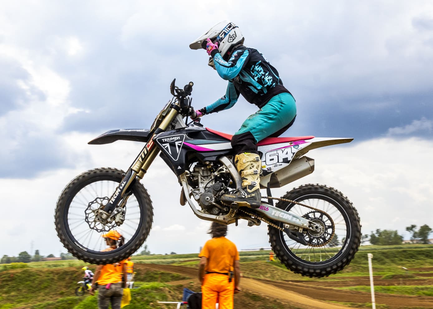 female motocross rider on a dirt track