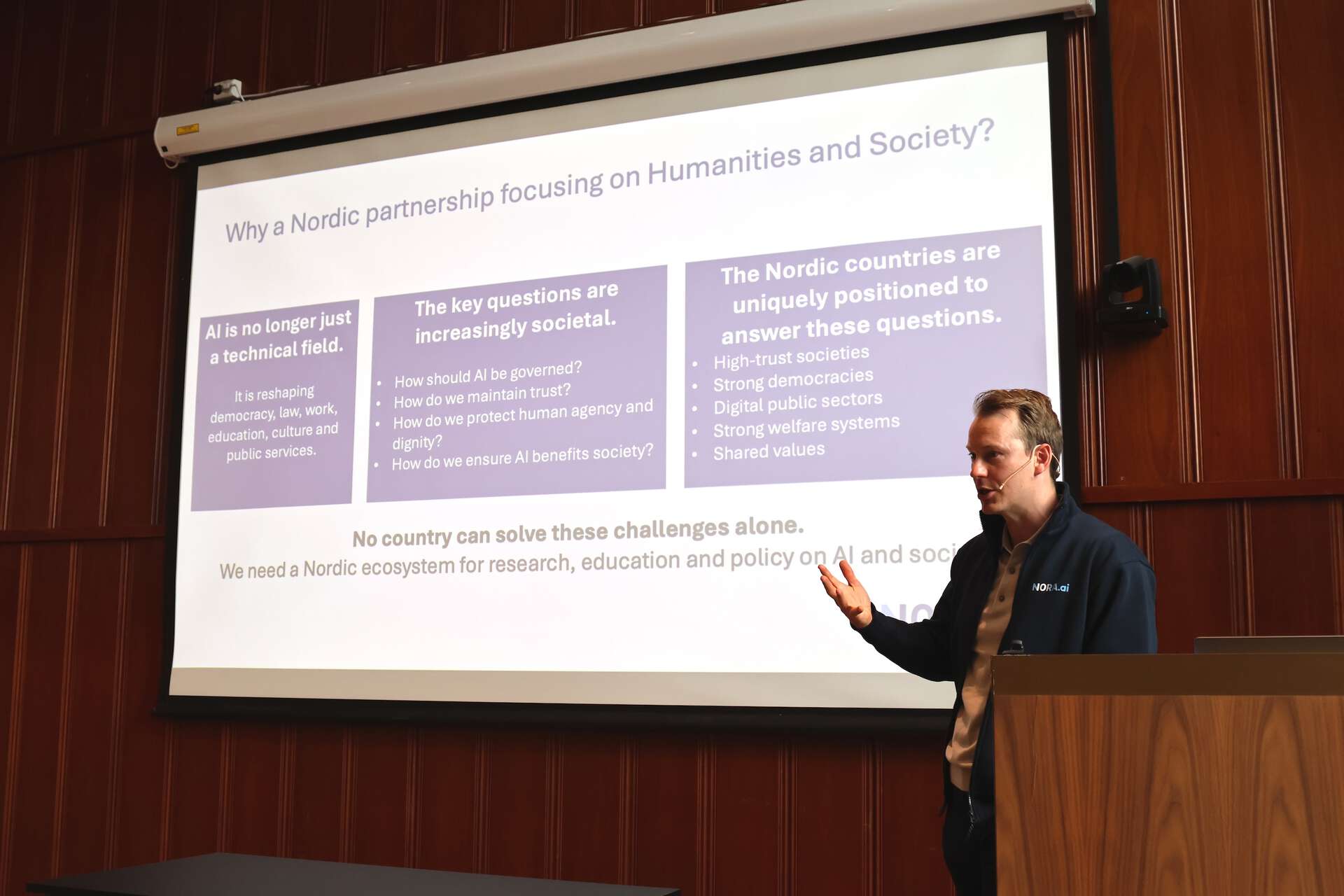 Michael Solvang presenting in front of a screen