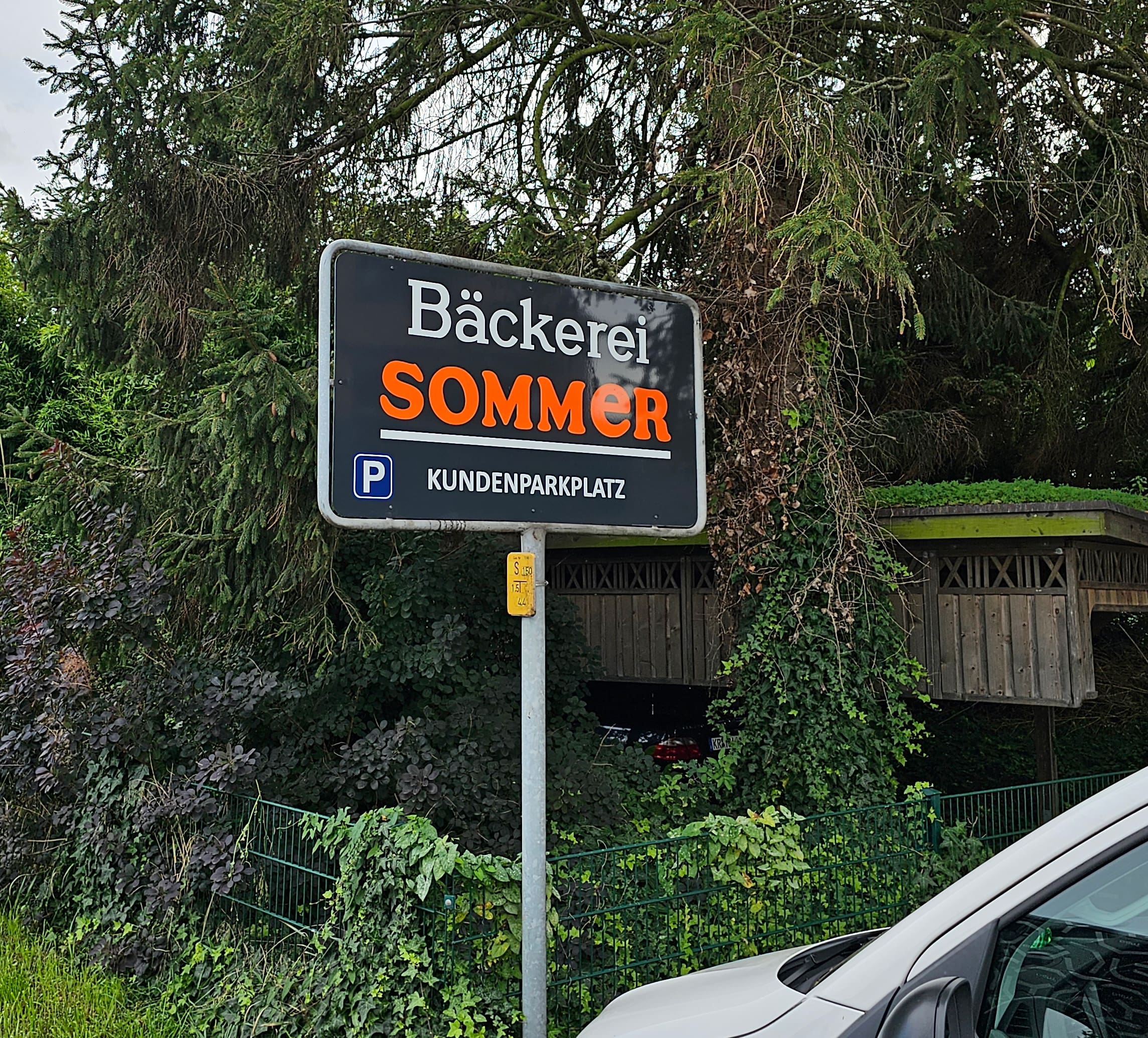 Parkplatzschild Bäckerei Sommer