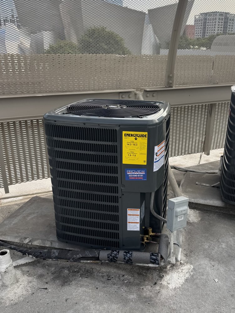 Outdoor AC condenser unit installed on a rooftop.
