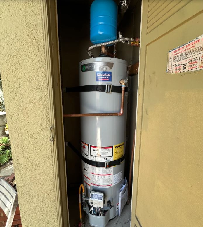 Water heater installation in Pasadena CA featuring A.O. Smith tank water heater with blue expansion tank and copper connections"