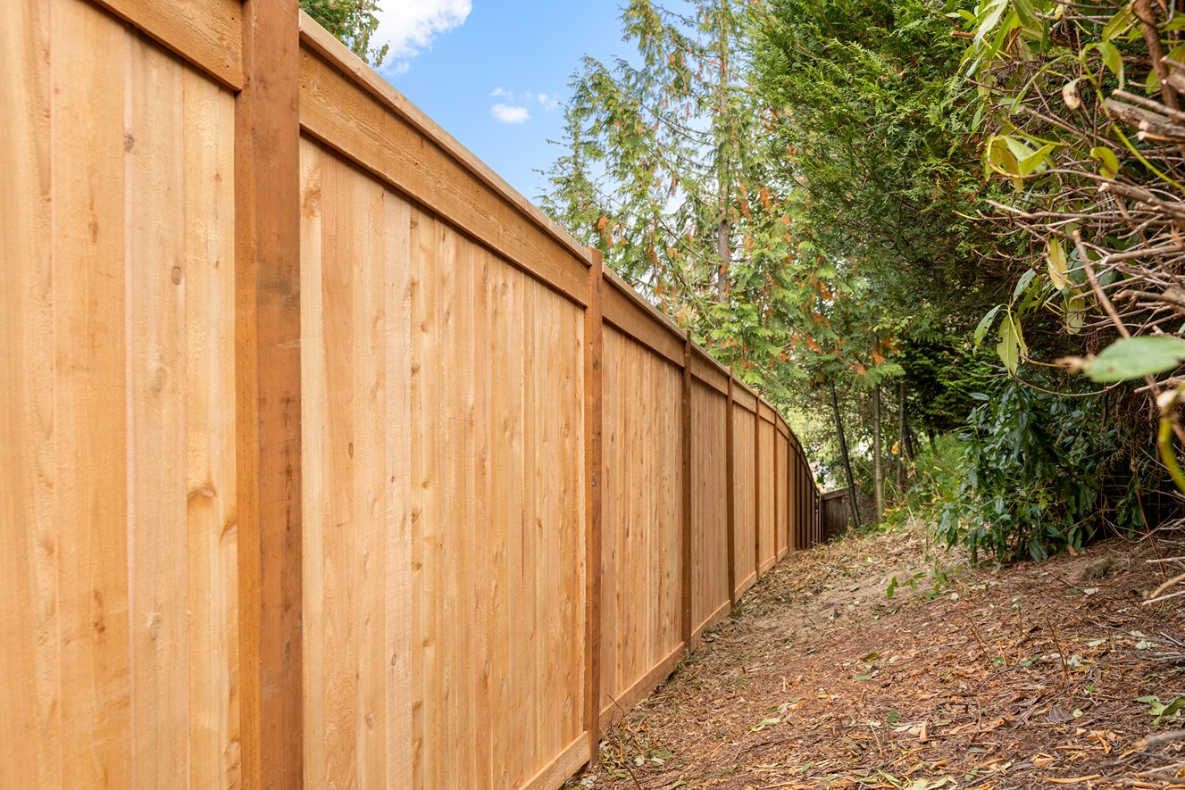 Classic wooden fence with vertical panels and posts