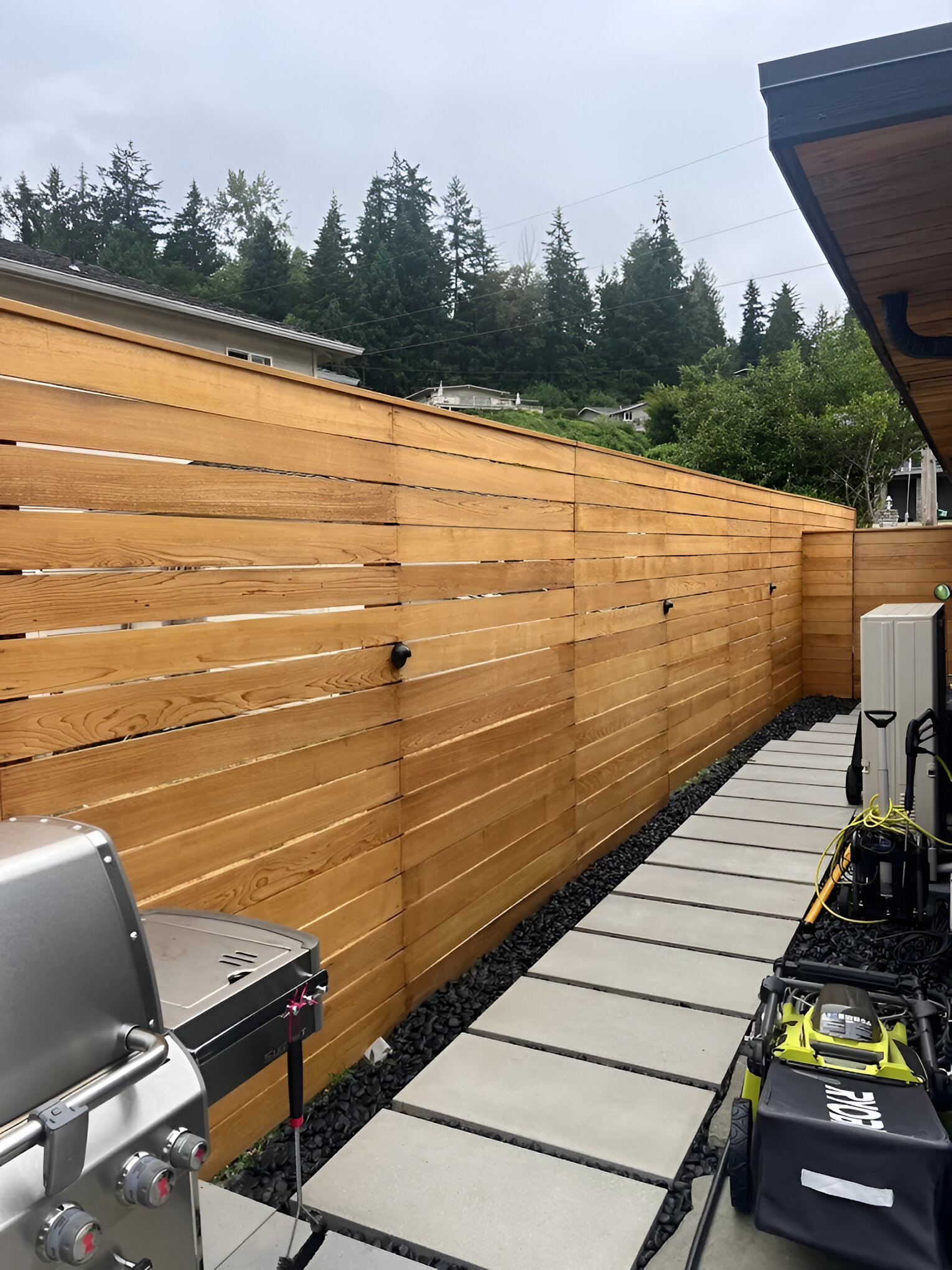Wood privacy fence enclosing a residential backyard