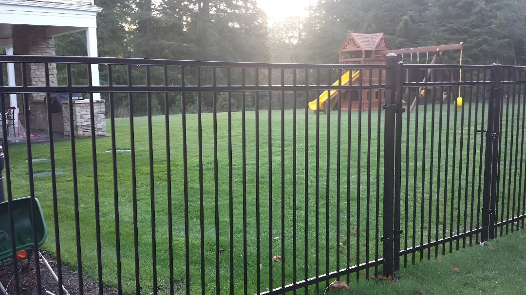 Outdoor playground enclosed by a steel fencing for daycare play area