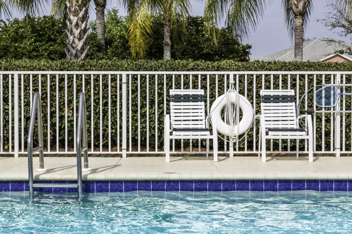 A swimming pool in Seattle enclosed with aluminum fence