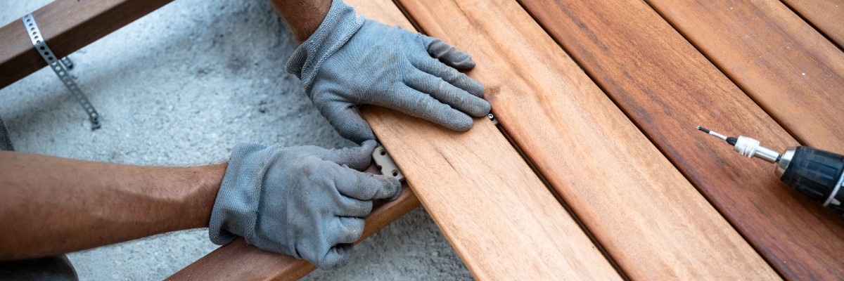 Cedar deck installation in process with contractor setting cedar panels in Seattle