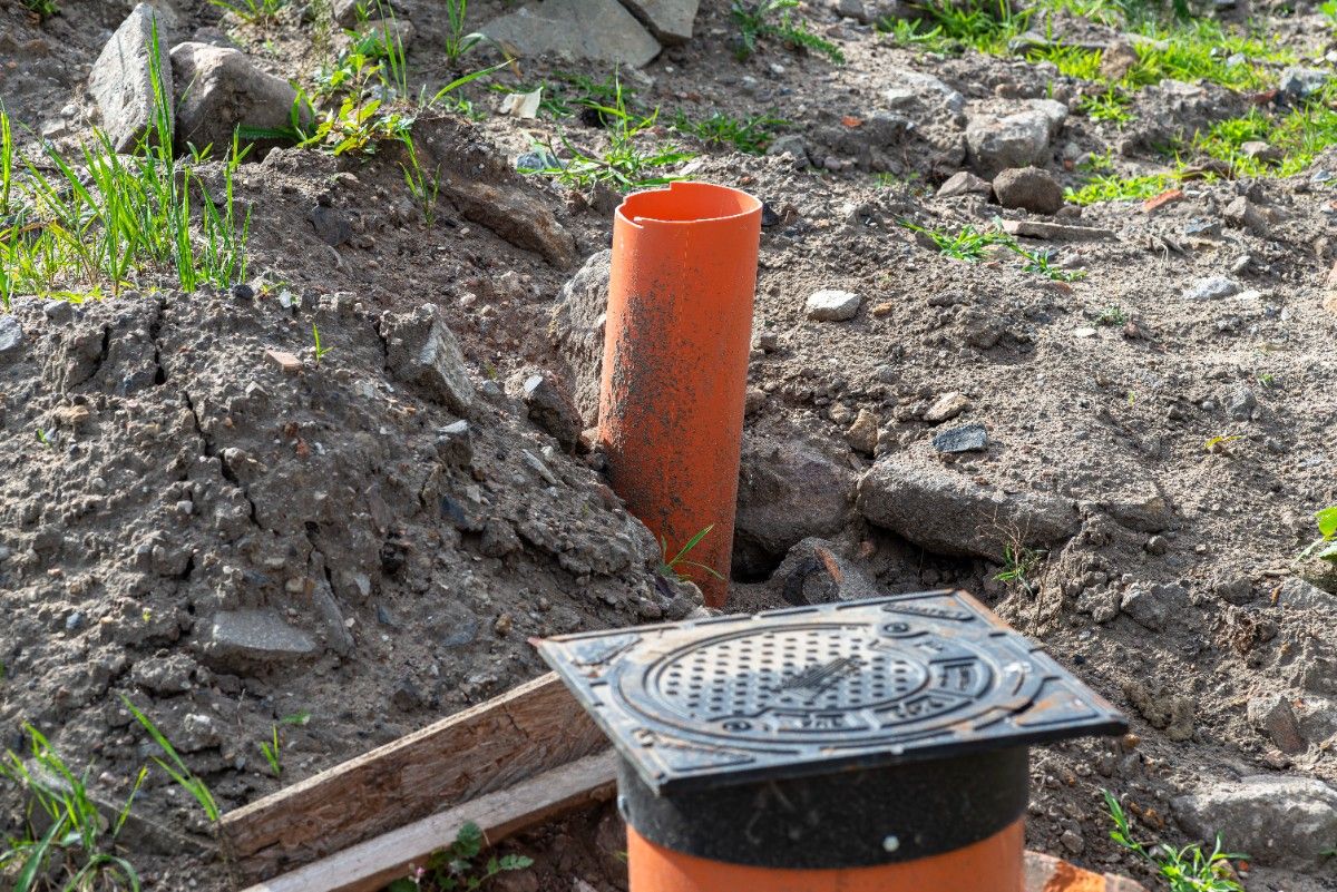 Fence post drainage on sloped yard to avoid water pooling