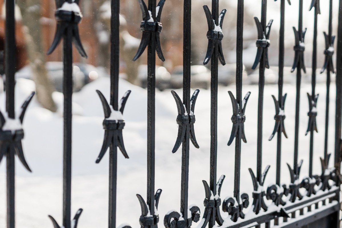 Aluminum fence in Seattle covered in snow