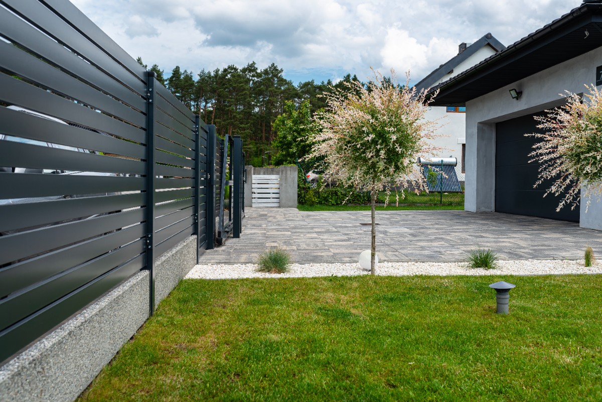Composite fence in Seattle backyard in front of a garage