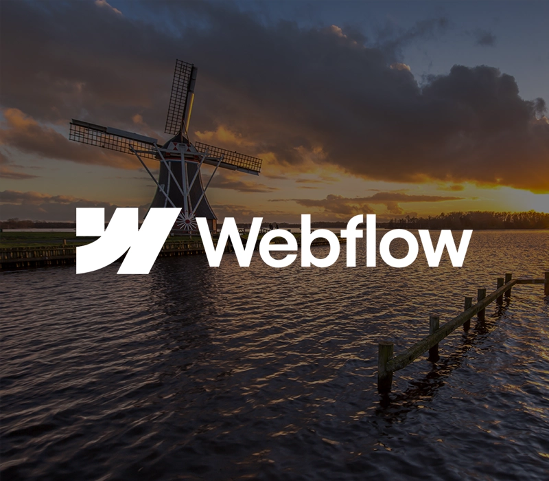 Het Webflow logo met molens en een rivier op de achtergrond