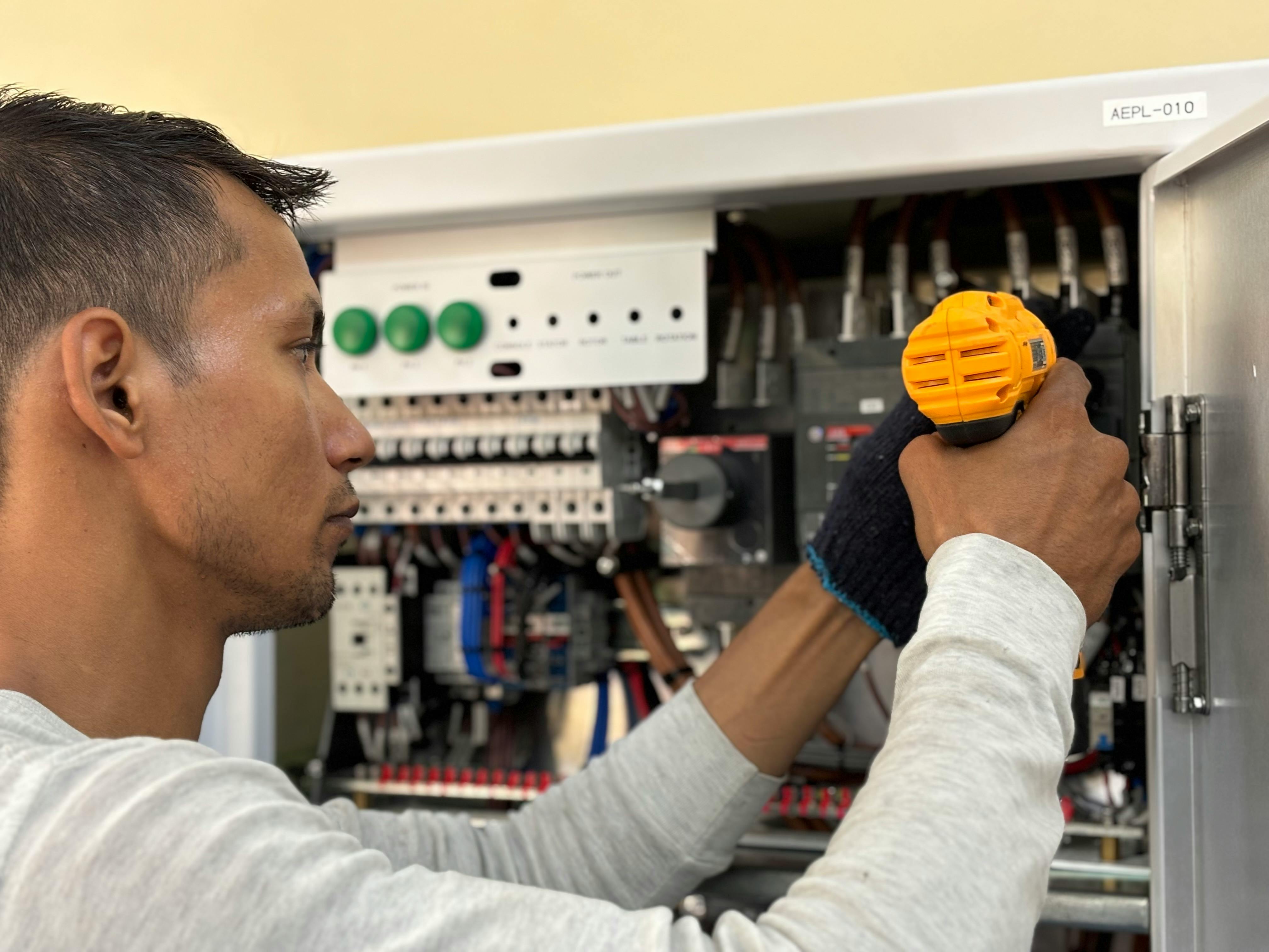 Man fixing electrical mains