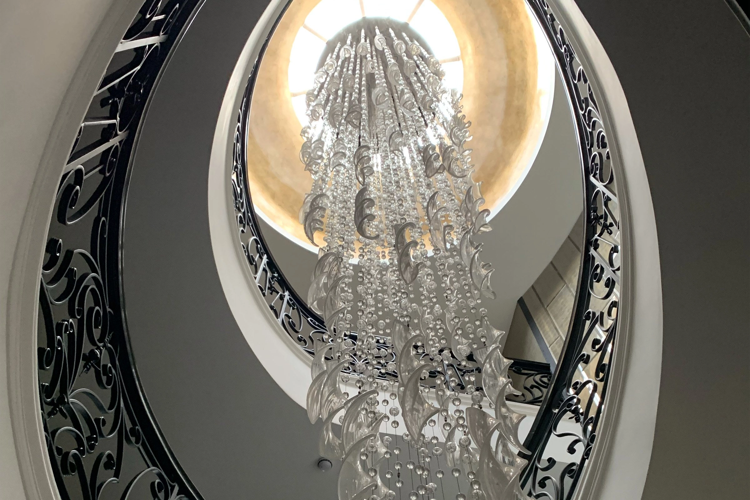 Statement chandelier with Lutron lighting control