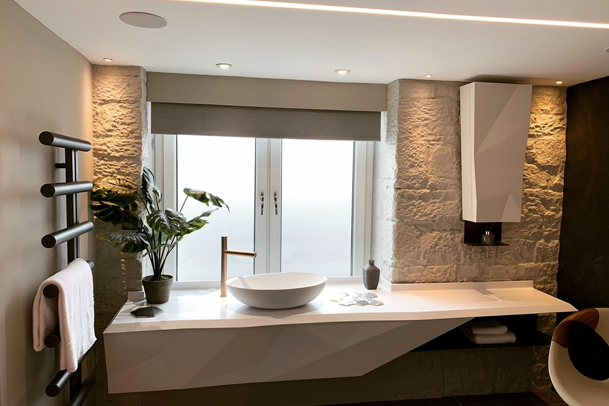 Designer bathroom featuring Rako lighting control and Sonance in-ceiling speakers