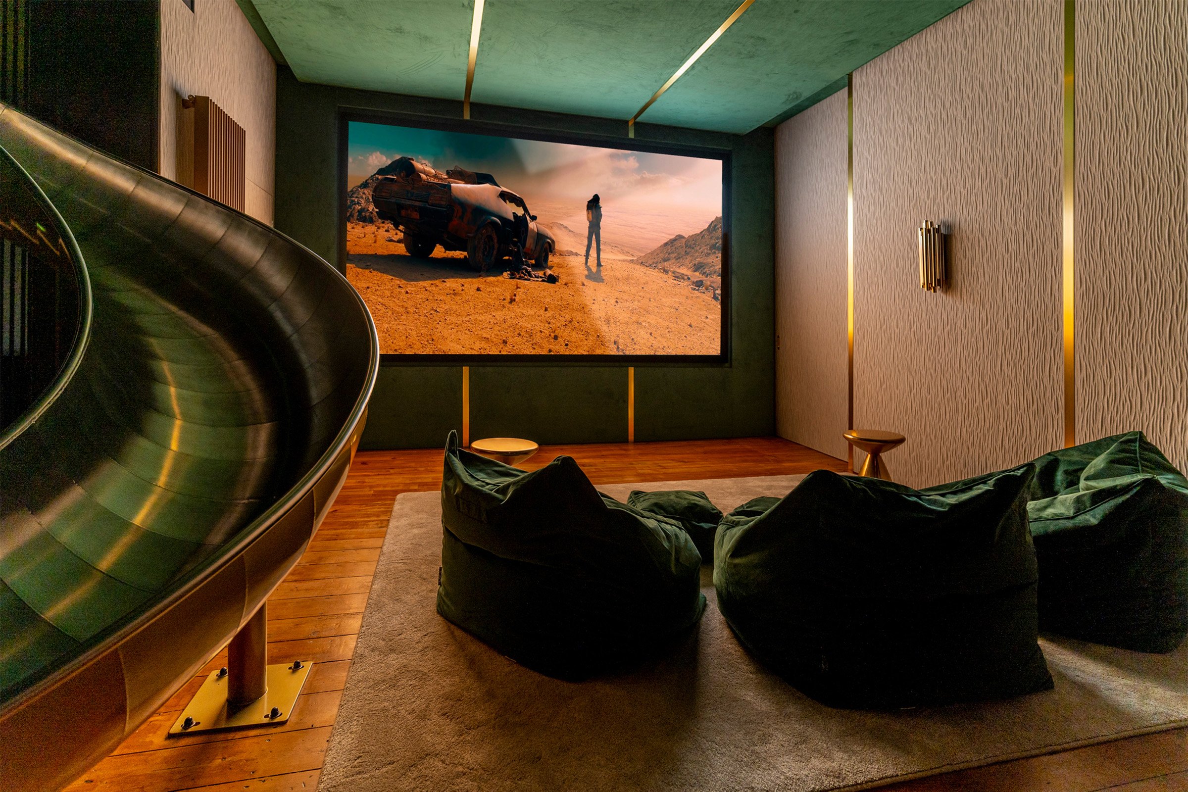 Luxury cinema and entertainment room featuring stretch fabric walls and luxury AV systems